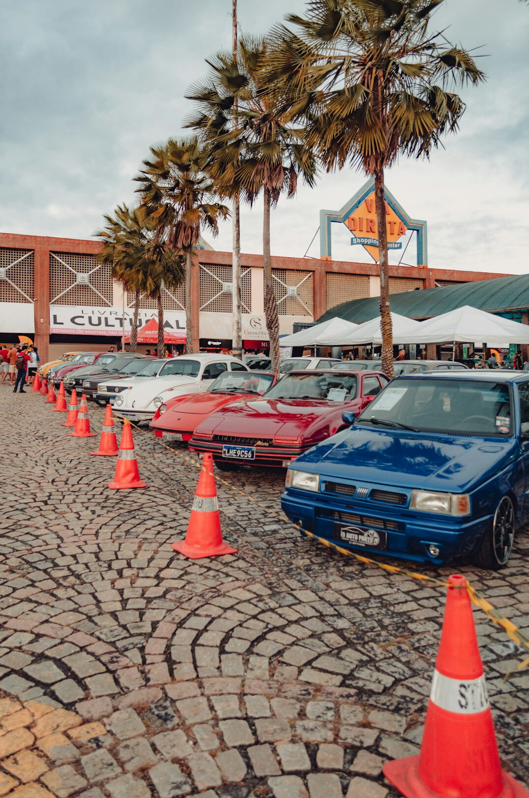 Rows of classic cars parked at an outdoor exhibition