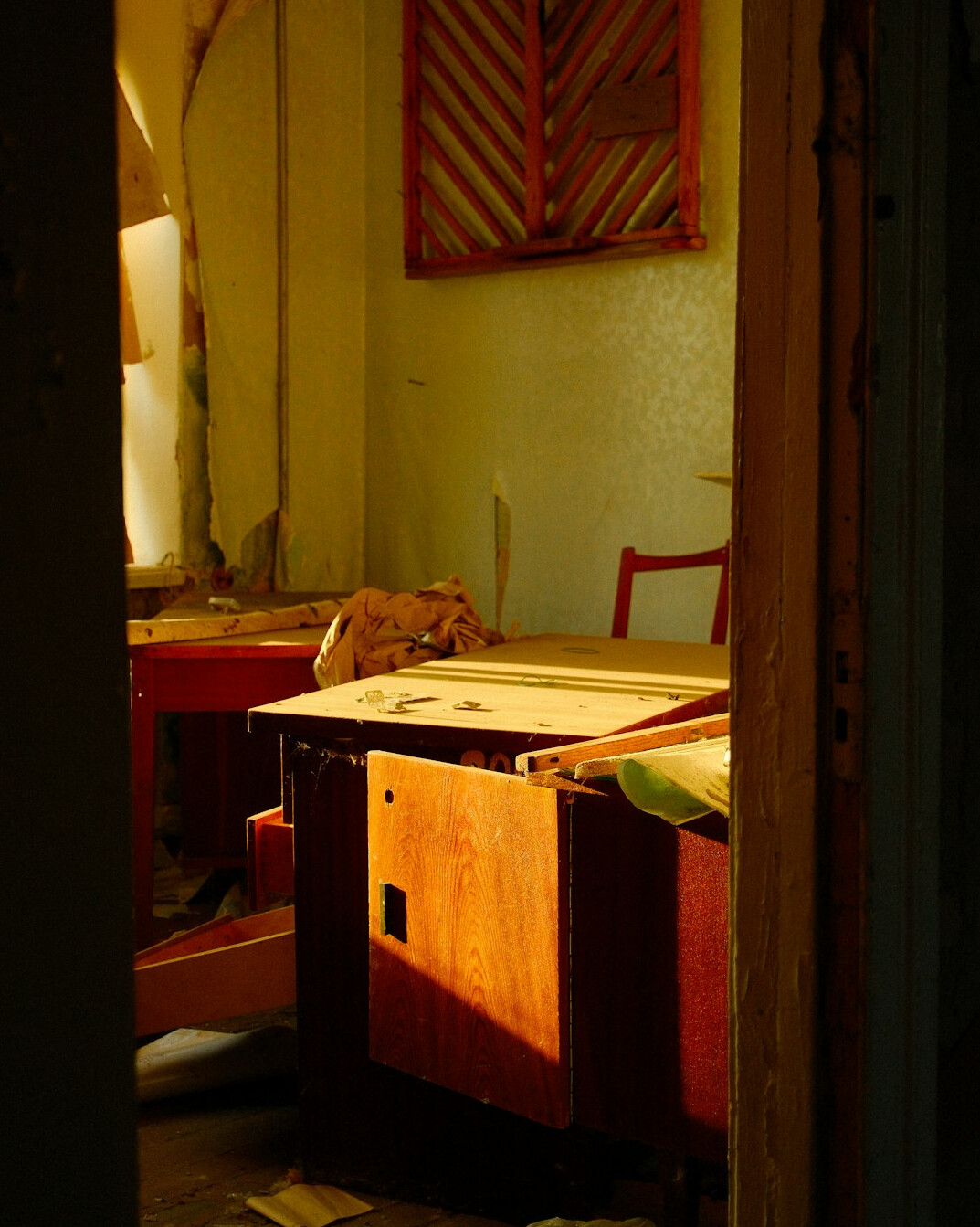 Archival documents and old photographs on a wooden desk