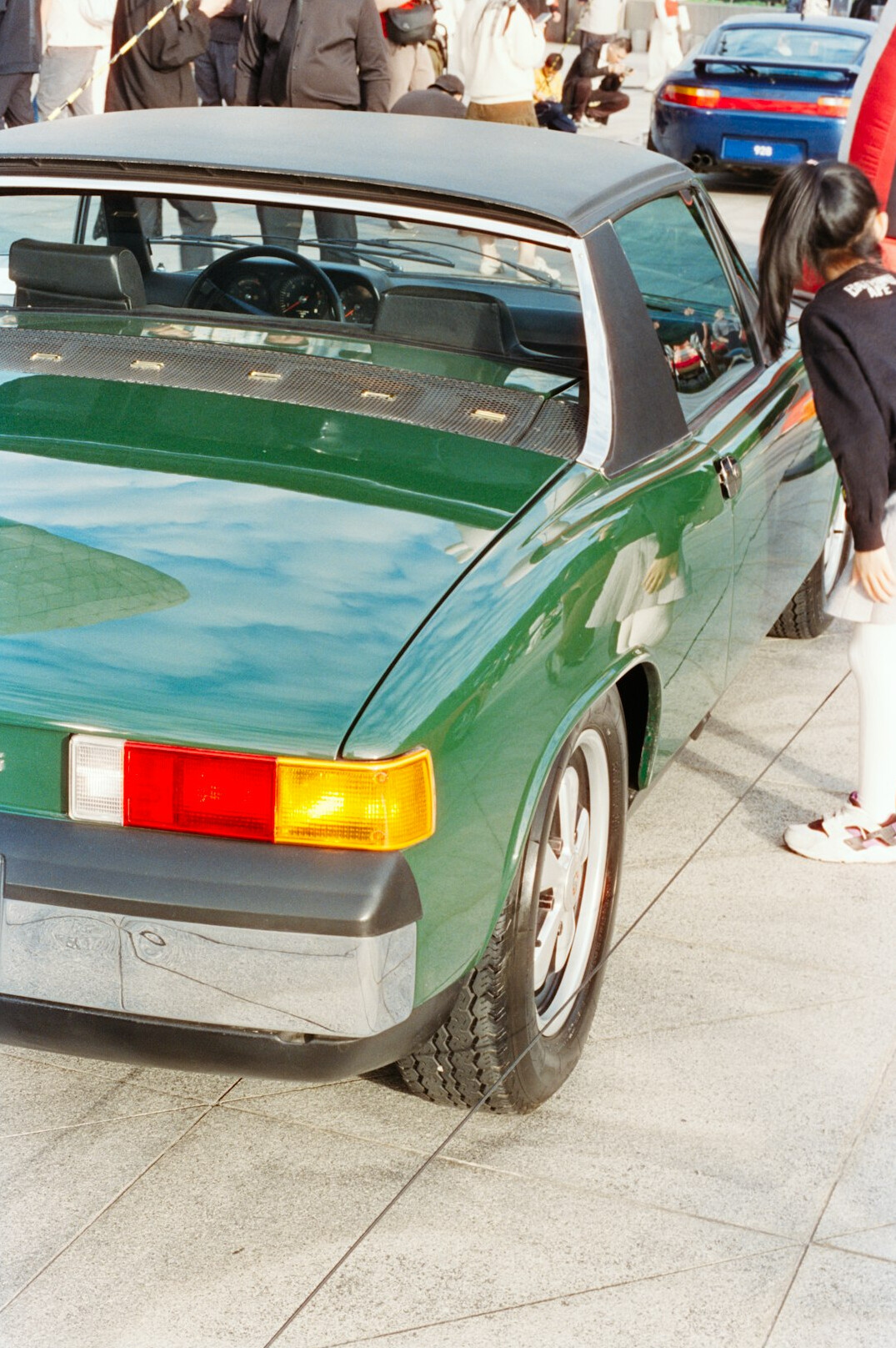 Journalist taking notes at a classic car exhibition